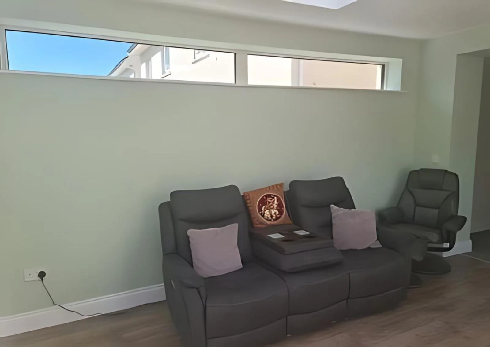 Seating area beneath horizontal windows in Castleknock