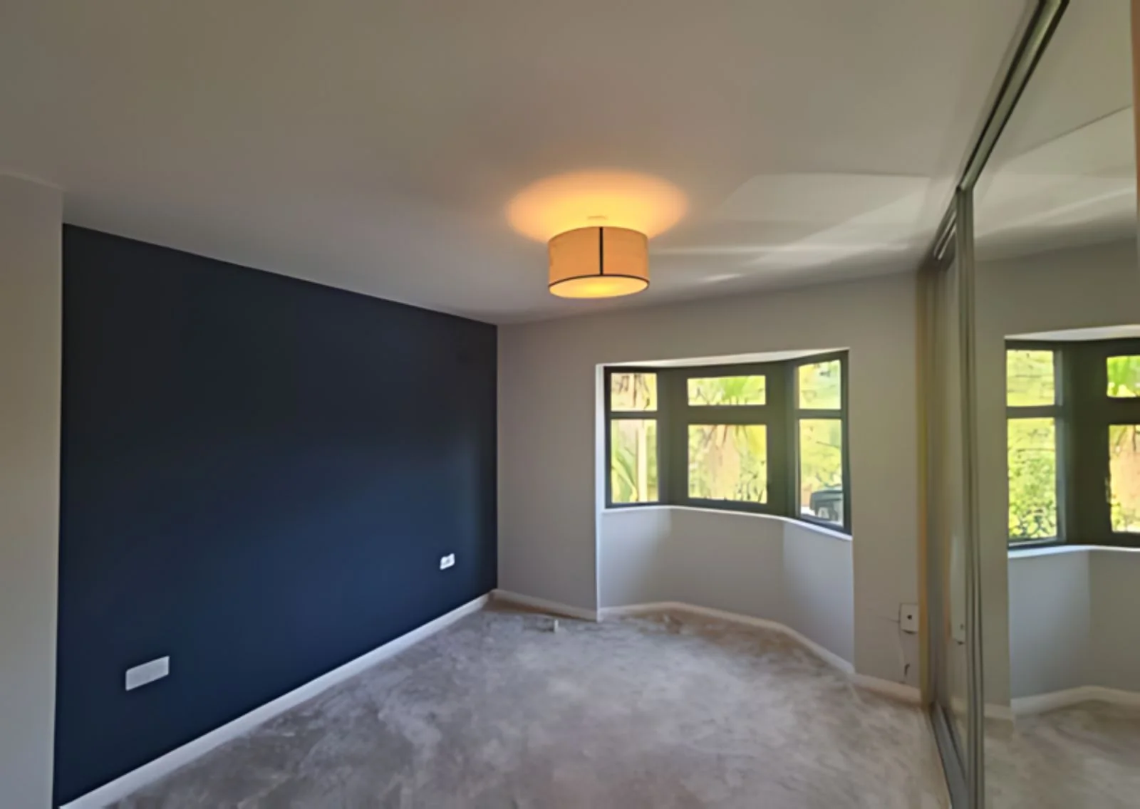 Renovated living room with blue feature wall in Dublin 18
